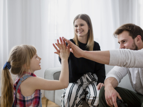 family-high-fiving-living-room
